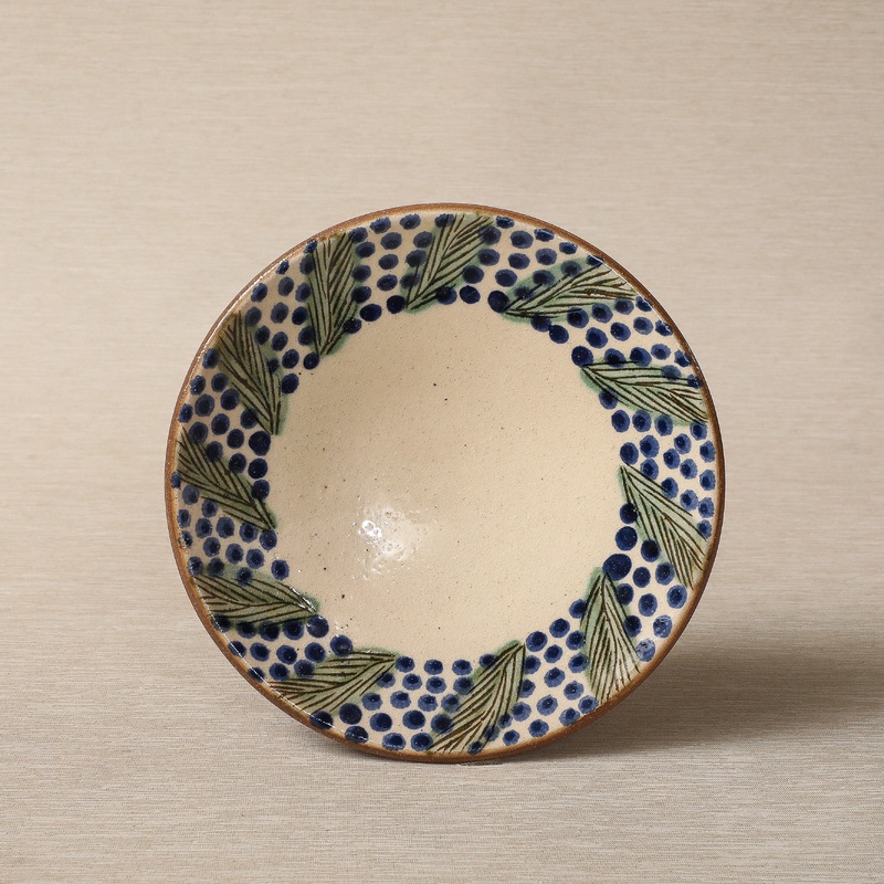 Hand painted plate with wreath decorated edge